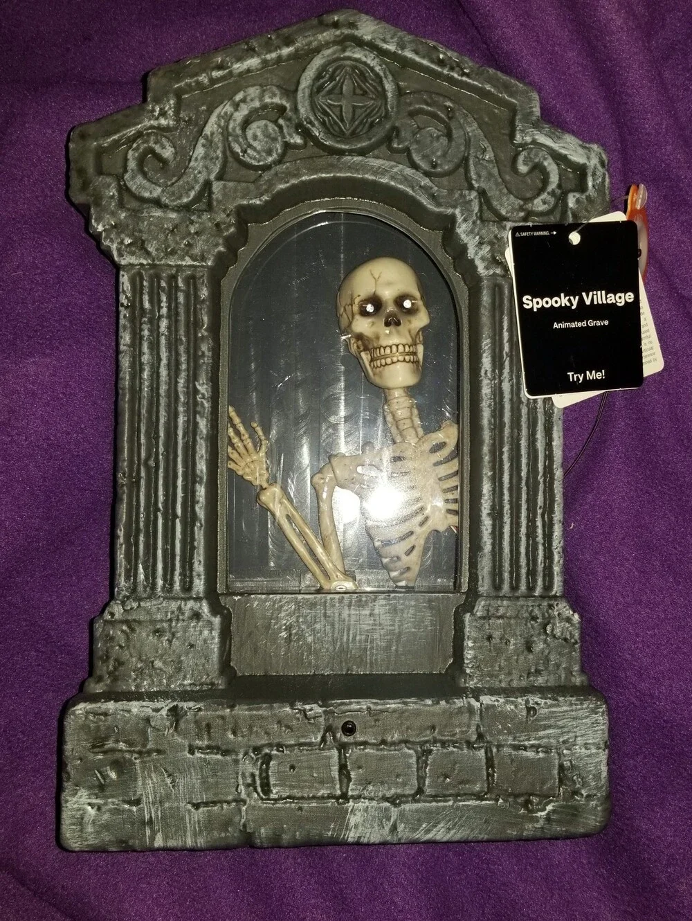 NWT 12-inch Spooky Village Motion Activated Animated Skeleton Gravestone